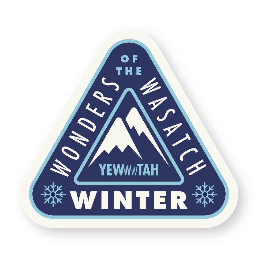 Triangular sticker with blue and white mountain design and text 'Wonders of the Wasatch, Yewwwtah Winter'
