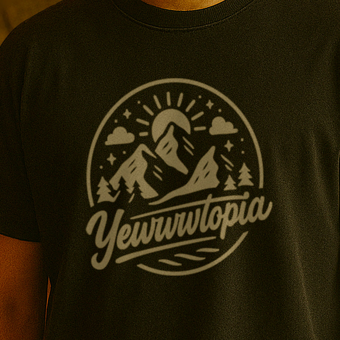 Black t-shirt with a mountain graphic and 'Yewwwtopia' text on a person wearing it.