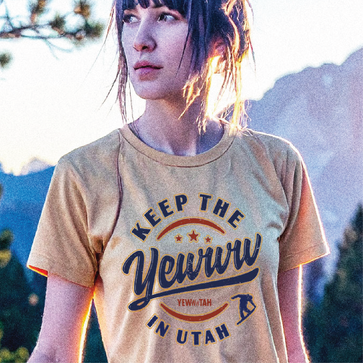 Woman wearing a t-shirt with 'Keep the Yewww in Utah' text against a mountainous background