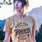 Woman wearing a t-shirt with 'Keep the Yewww in Utah' text against a mountainous background