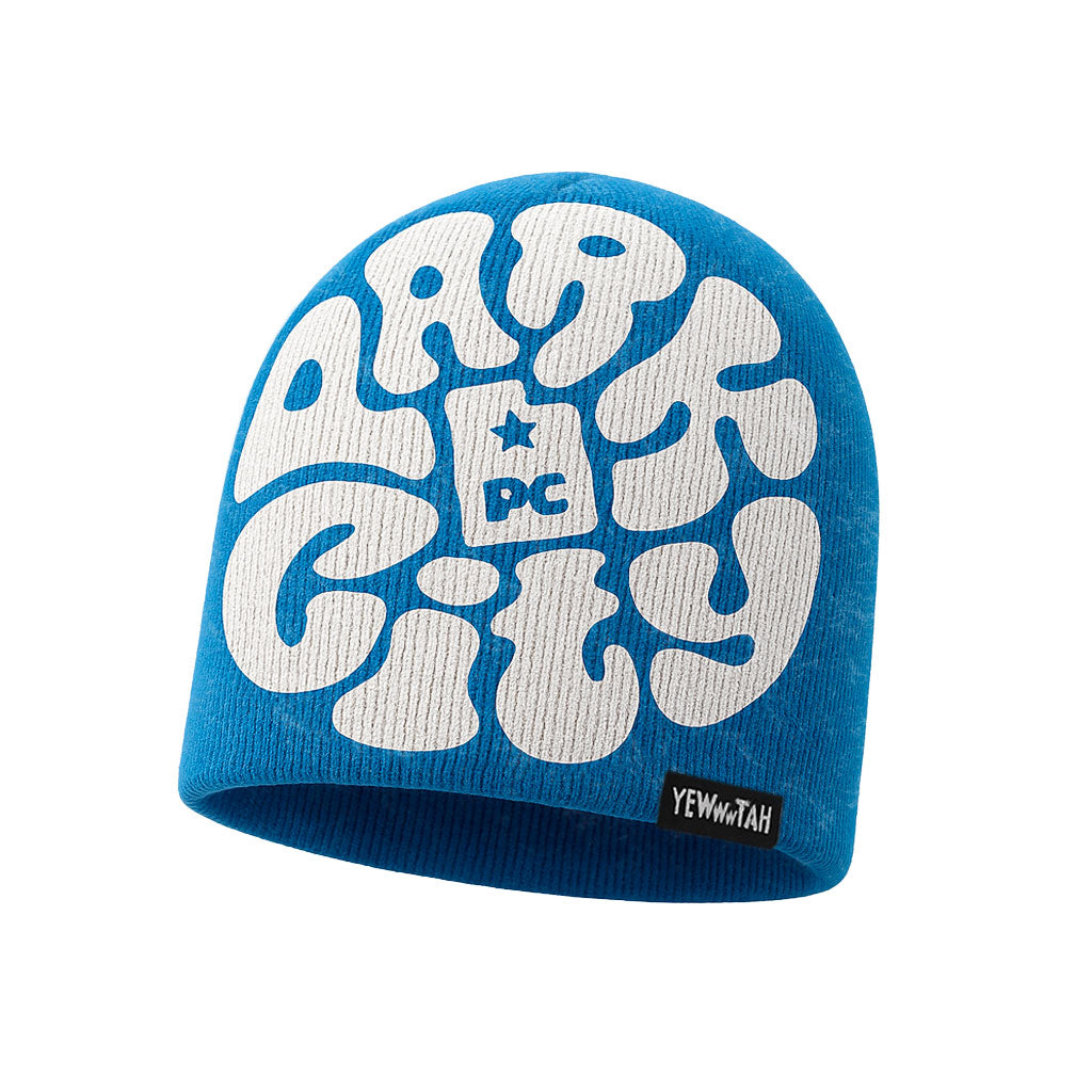 Blue beanie with white Park City UT text and Yewwwtah label a white back ground