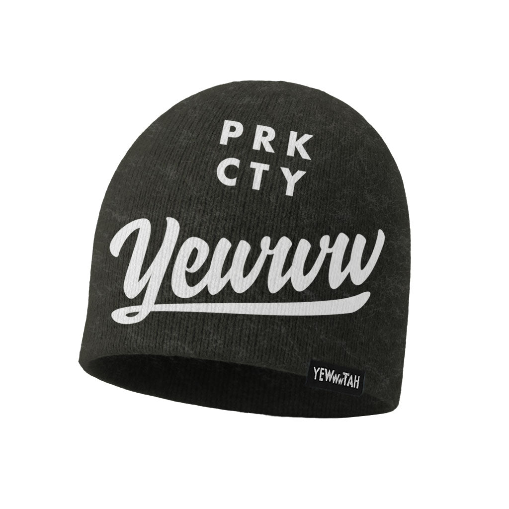 Black knitted beanie with white 'PRK CTY' and 'Yewww' logos on a white background