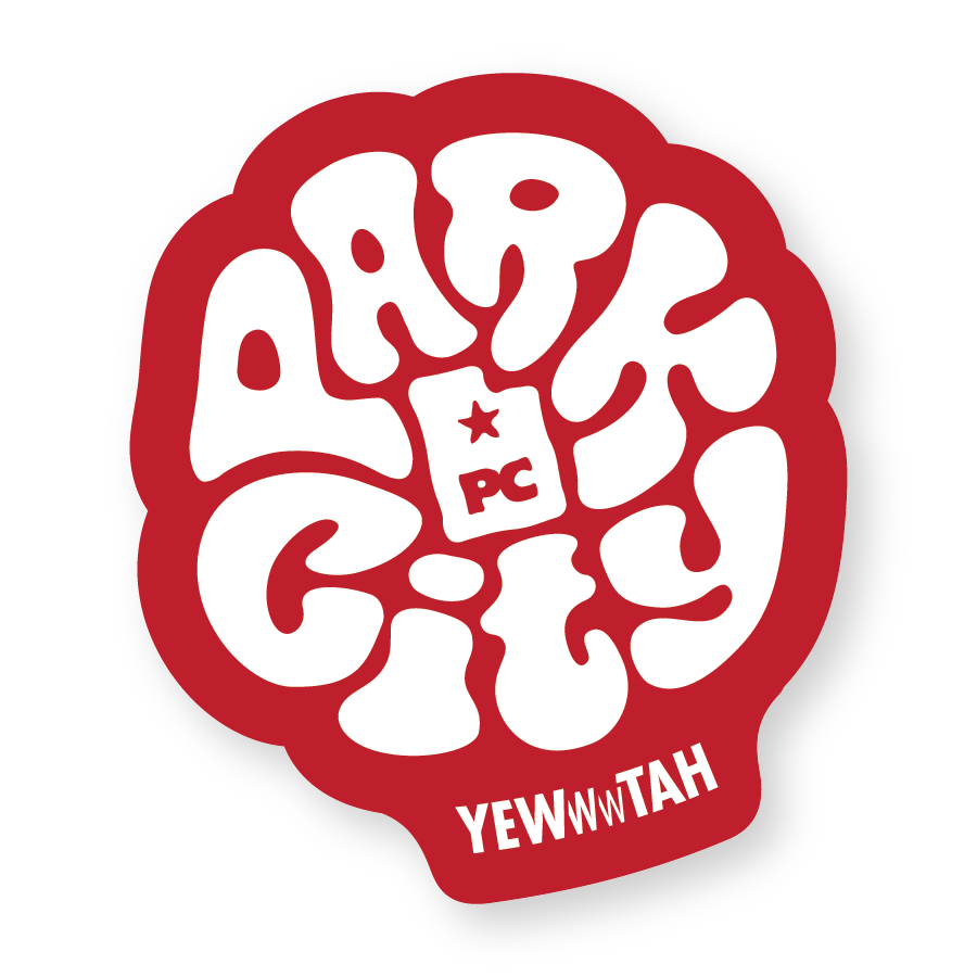 Red and white sticker with Park City Lettering and Yewwwtah logo with text on a white background