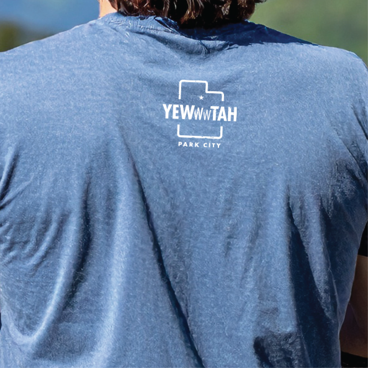 Blue t-shirt with 'YEWWWTAH - Park City' logo on the back