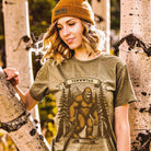 Person wearing a t-shirt with a Sasquatch graphic and 'Yewwwtah' text, standing outdoors.
