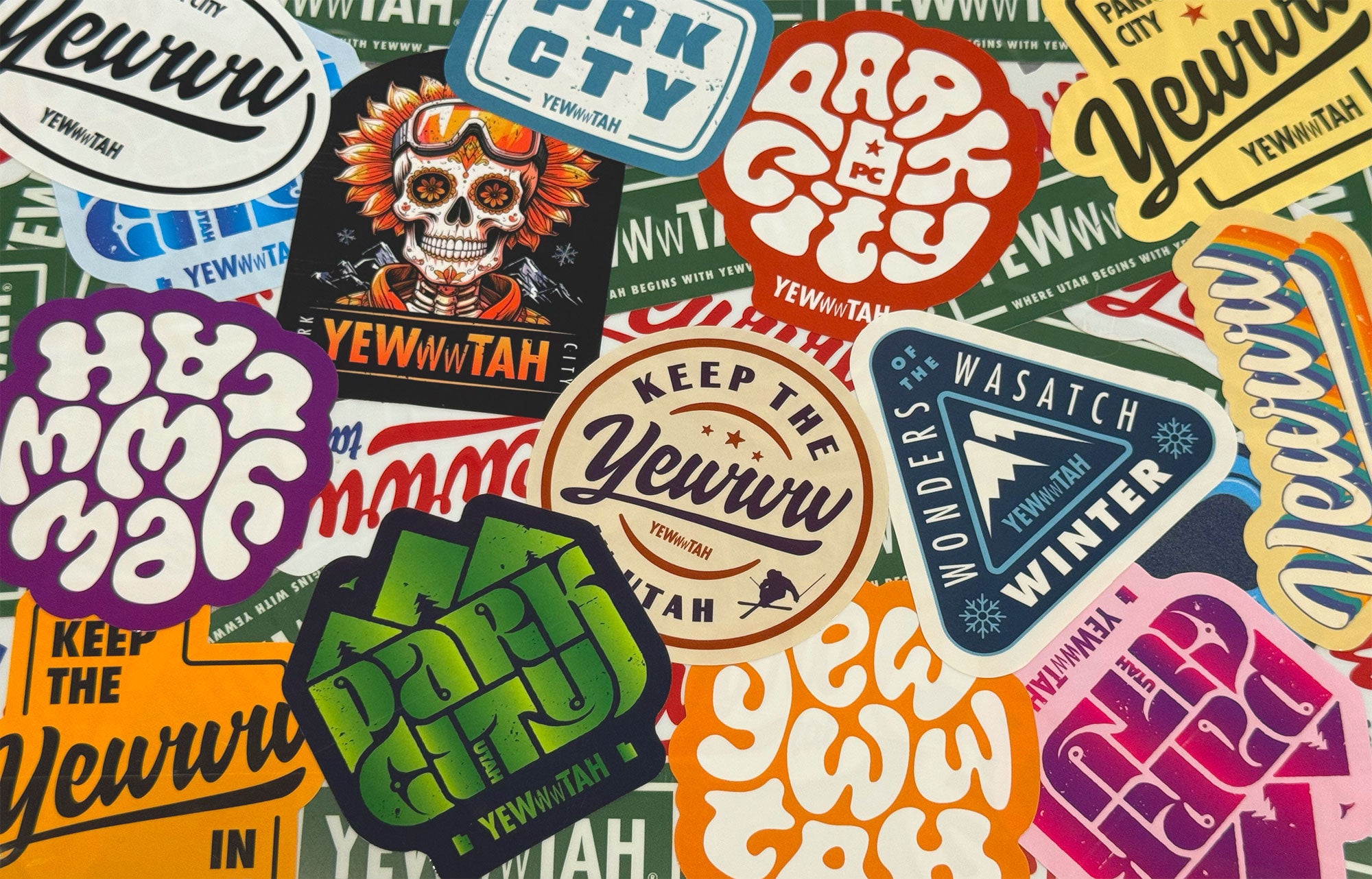 Collection of colorful stickers with various designs and text on a patterned background.